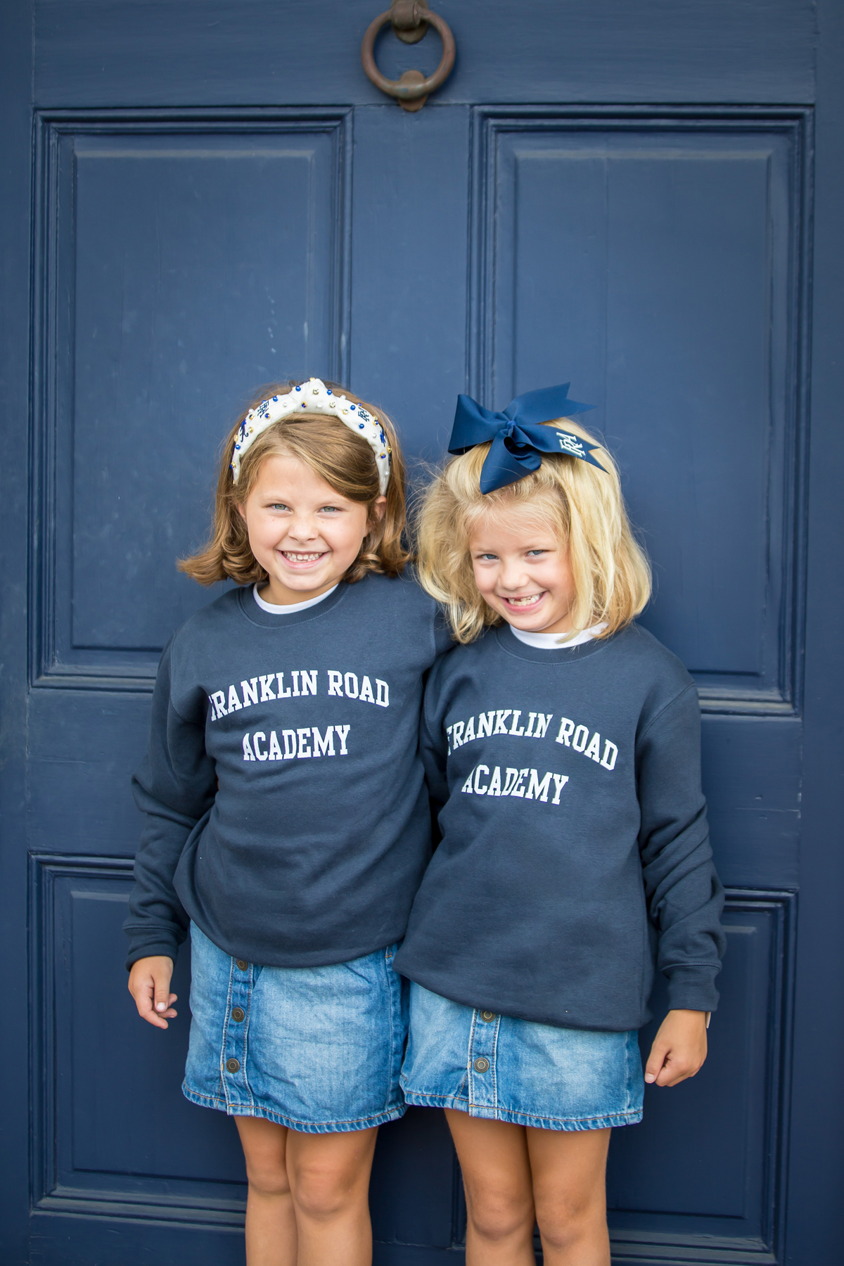 Young girls wearing FRA Spirit Store apparel.