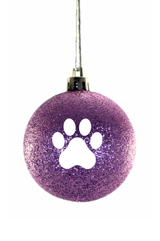 Purple glittery ball with a white paw print on a white background